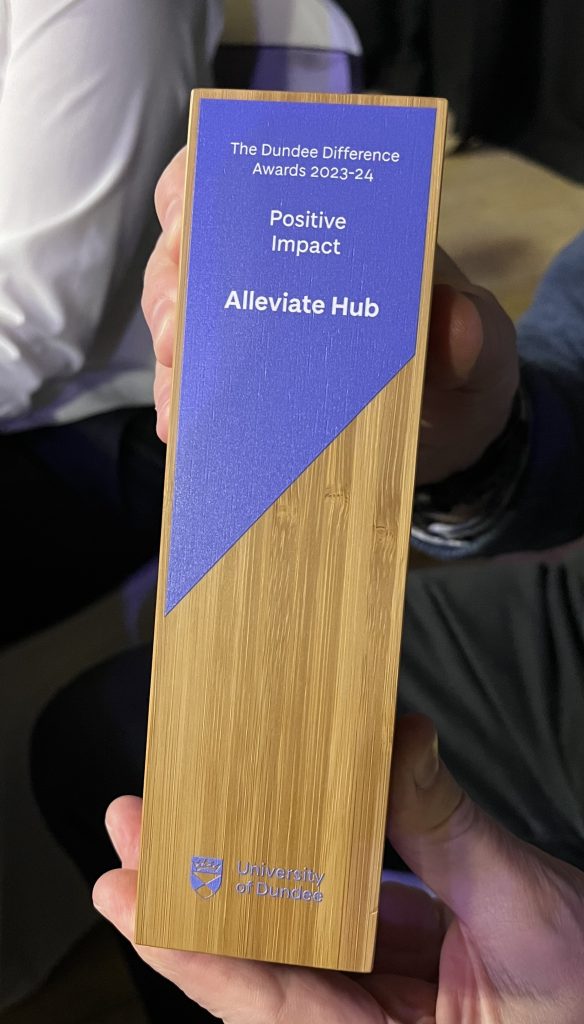 The wooden trophy with Alleviate's name printed on.